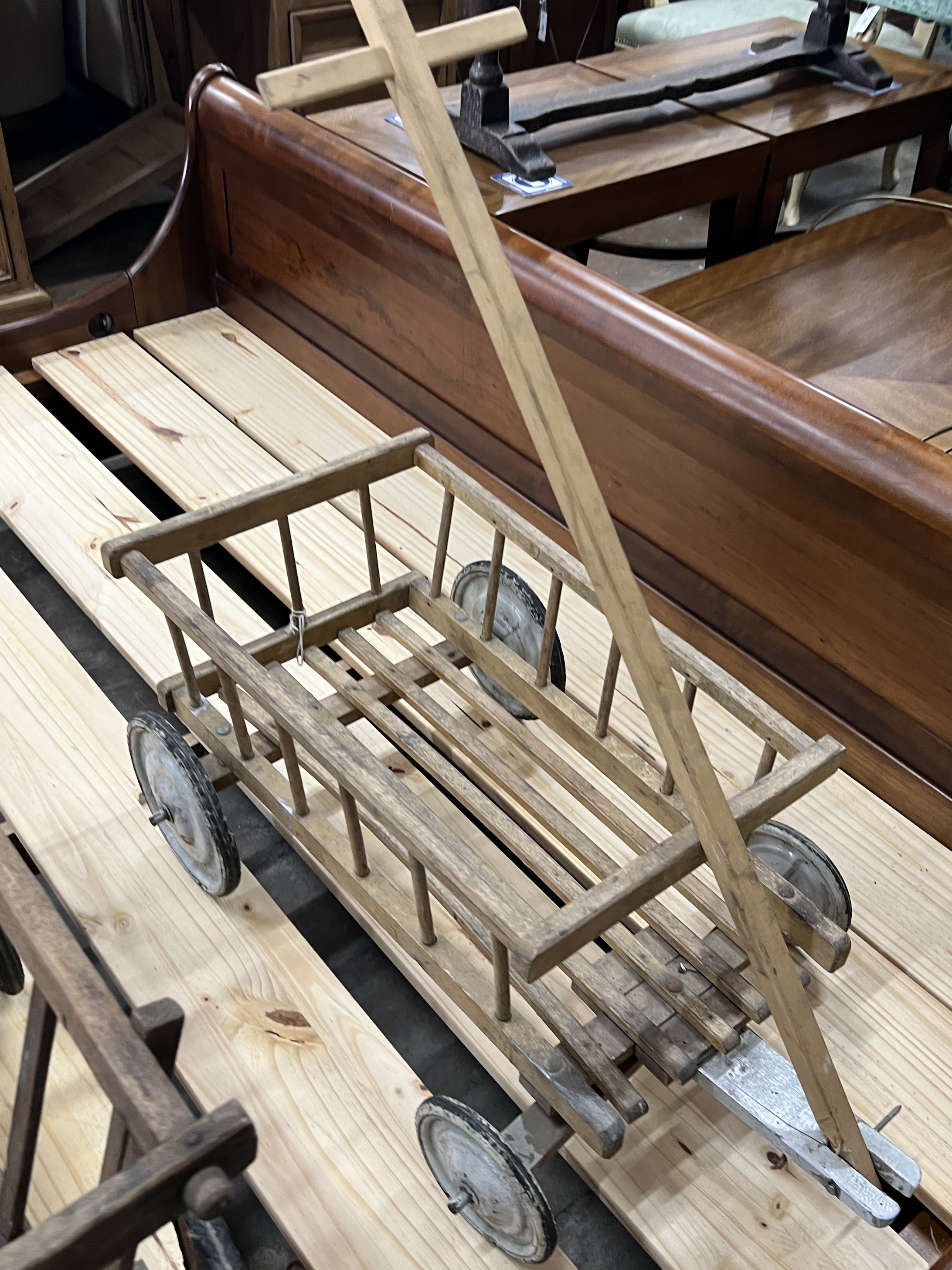 Two vintage pine and beech dog carts, larger length 70cm, width 48cm